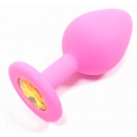 Анальная силиконовая пробка розовая с желтым кристаллом M Анальная силиконовая пробка розовая с желтым кристаллом M